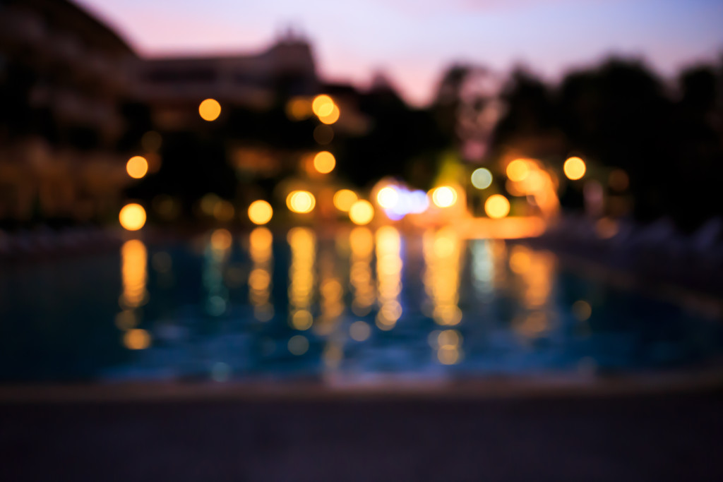 blurred image of house with outdoor lights