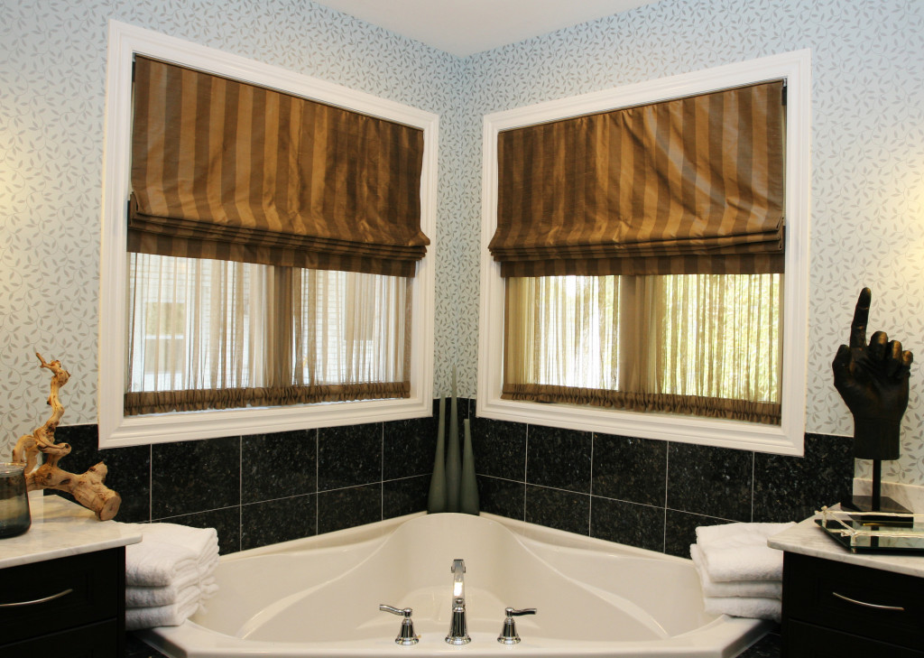 a bathroom with roman blinds