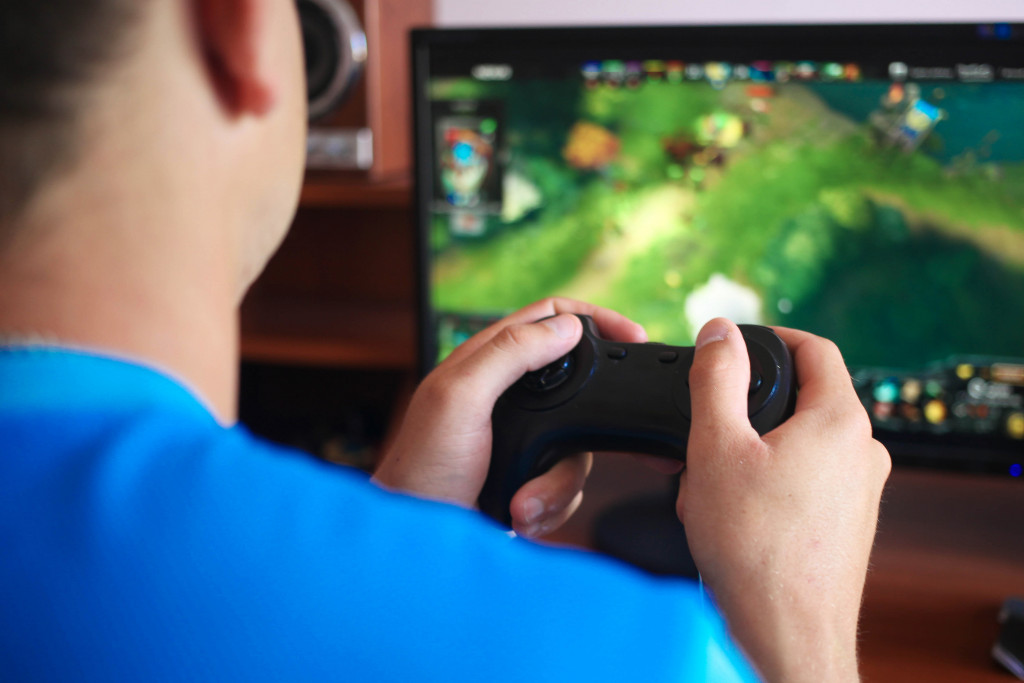 A man playing a video game on a computer