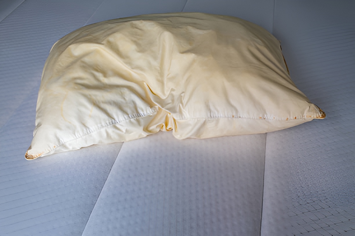 pillow with yellow stains on a mattress