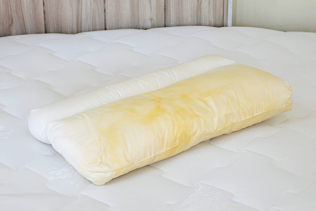 white pillow with yellow stains